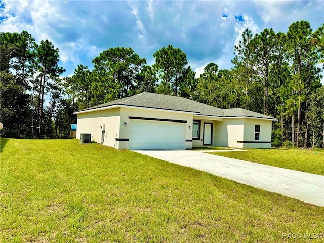 view of front of home with a front yard, a garage, and cooling unit