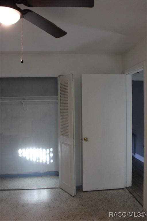 unfurnished bedroom with a closet and ceiling fan