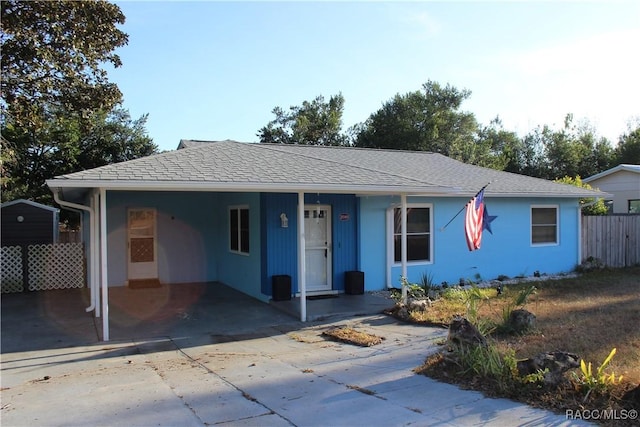 ranch-style home featuring a carport