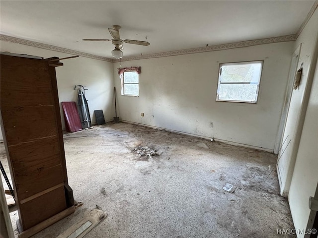 spare room featuring a ceiling fan