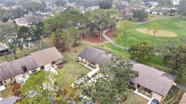 birds eye view of property with golf course view and a residential view