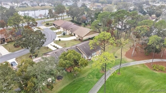 birds eye view of property with a water view and a residential view