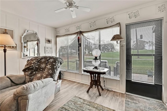 sunroom featuring a wealth of natural light and a ceiling fan