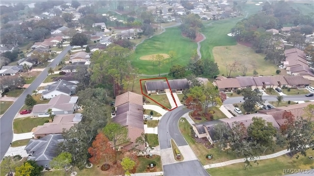 drone / aerial view featuring golf course view and a residential view