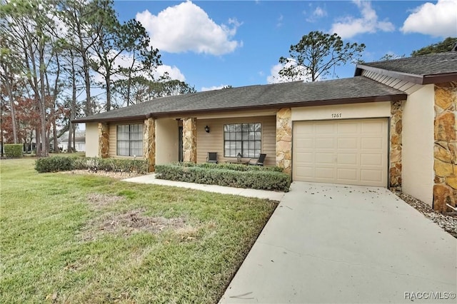 view of front of property featuring a garage, stone siding, a front lawn, and concrete driveway