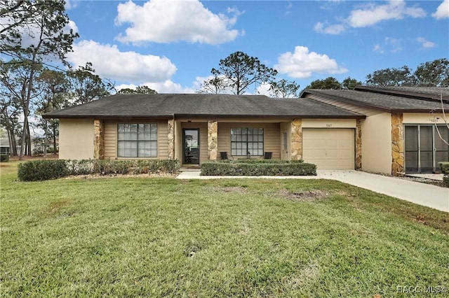 view of front facade with a garage, stone siding, a front lawn, and concrete driveway