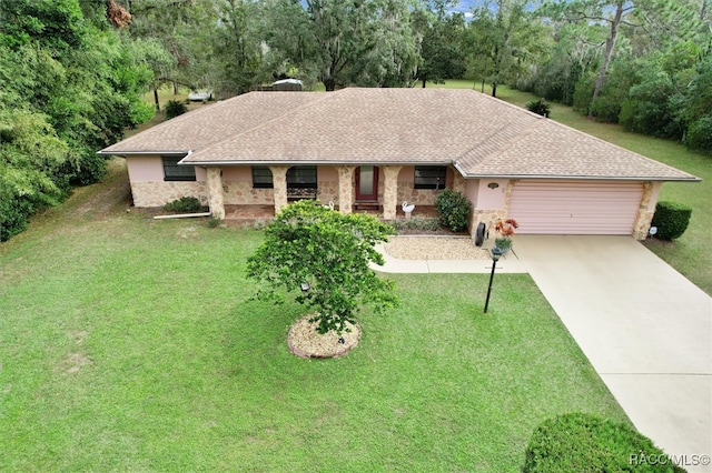 ranch-style home with a garage and a front lawn