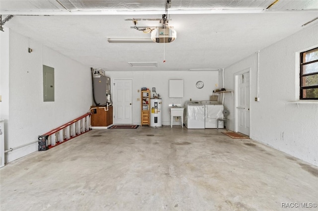 garage with sink, washing machine and clothes dryer, electric panel, a garage door opener, and electric water heater