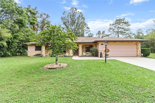 single story home with a garage and a front lawn