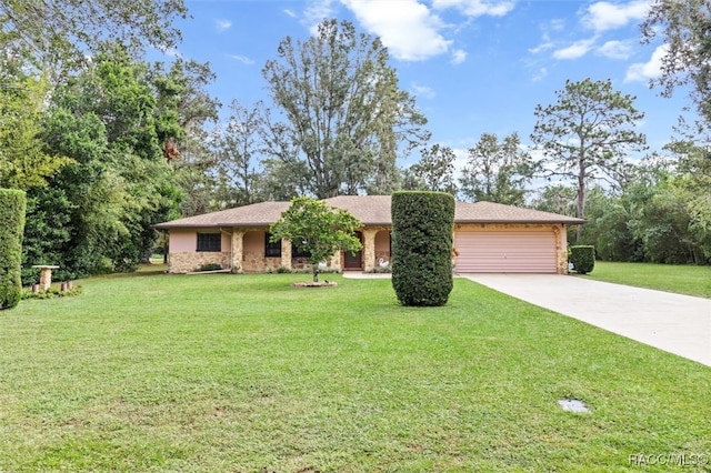 ranch-style house with a garage and a front lawn