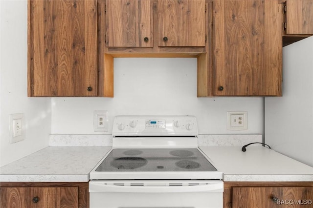 kitchen featuring white range with electric stovetop