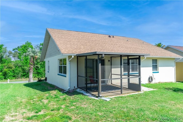 906 W Colbert Ct, Beverly Hills, FL 34465 - rear view of property with a sunroom, a yard, and stucco siding