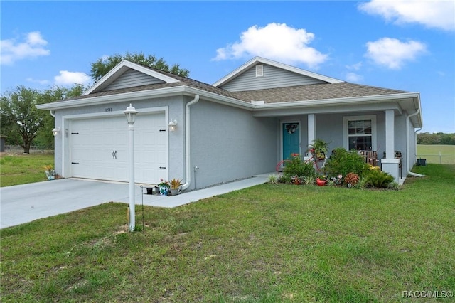 10541 S Drew Bryant Cir, Floral City, FL 34436 - single story home featuring concrete driveway, a shingled roof, an attached garage, a front yard, and stucco siding