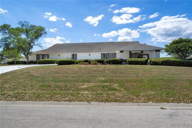 10541 S Drew Bryant Cir, Floral City, FL 34436 - single story home with concrete driveway, a front yard, and stucco siding
