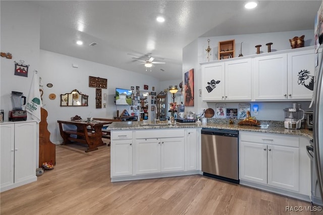 10541 S Drew Bryant Cir, Floral City, FL 34436 - kitchen with dishwasher, white cabinets, a peninsula, and a ceiling fan