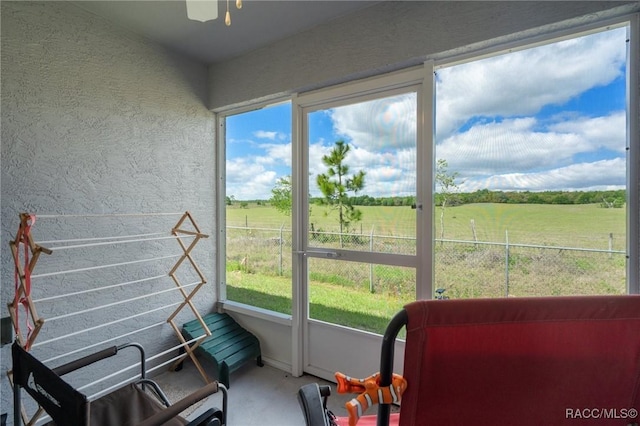 10541 S Drew Bryant Cir, Floral City, FL 34436 - sunroom with a rural view and a ceiling fan