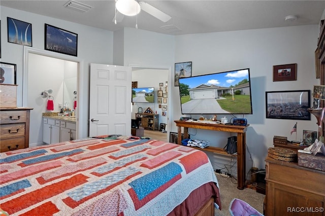 10541 S Drew Bryant Cir, Floral City, FL 34436 - bedroom featuring ceiling fan, ensuite bath, visible vents, and carpet