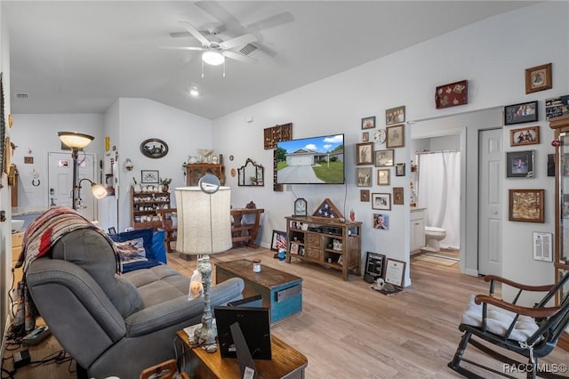 10541 S Drew Bryant Cir, Floral City, FL 34436 - living room with light wood-style floors, ceiling fan, baseboards, lofted ceiling, and visible vents