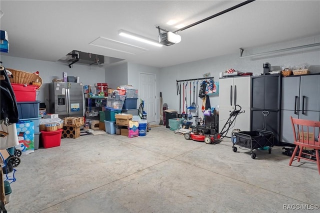 10541 S Drew Bryant Cir, Floral City, FL 34436 - garage featuring a garage door opener and stainless steel fridge with ice dispenser