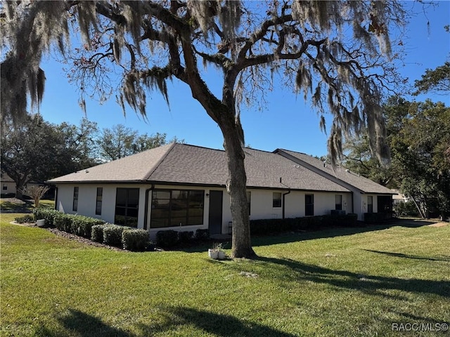 view of home's exterior featuring a lawn