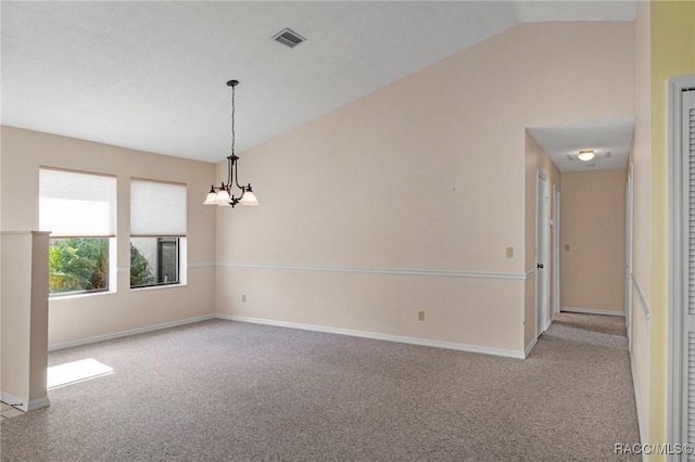 empty room with vaulted ceiling, light carpet, and a notable chandelier