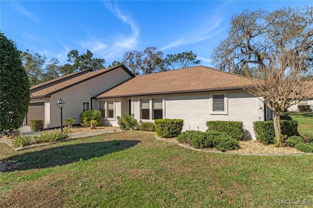 rear view of property featuring a lawn