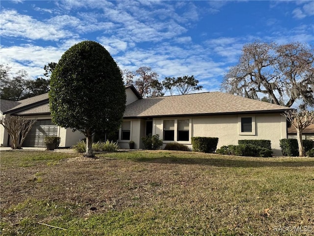 ranch-style home with a front lawn