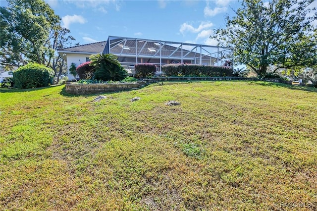 view of yard featuring a lanai