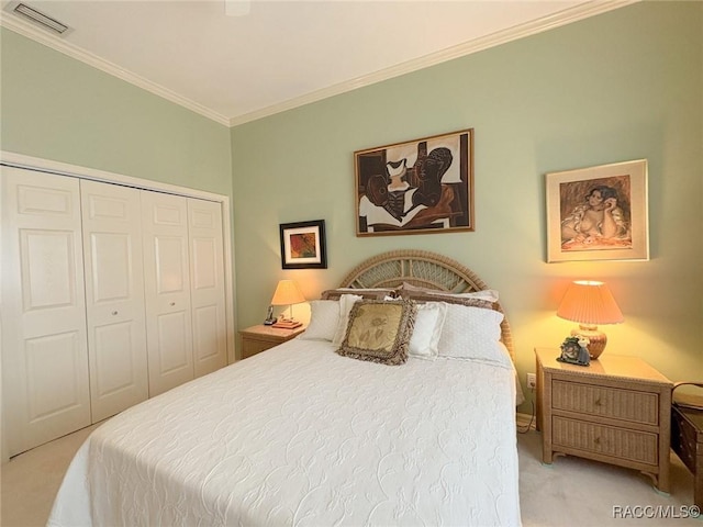 bedroom featuring light carpet, a closet, and ornamental molding