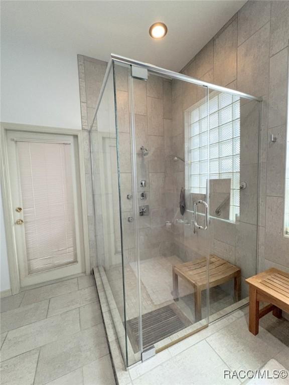 bathroom featuring an enclosed shower