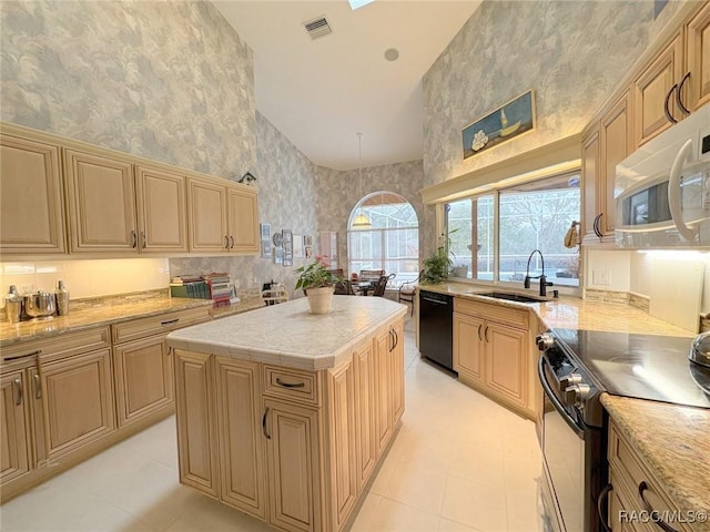 kitchen featuring black dishwasher, a towering ceiling, electric range oven, a kitchen island, and sink