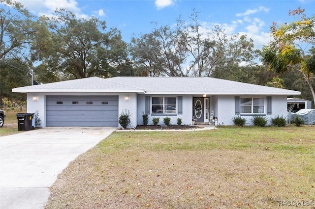 single story home with a front yard and a garage