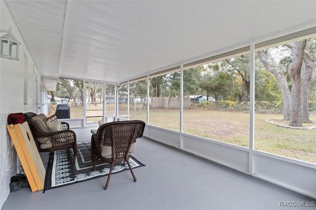 sunroom / solarium featuring a healthy amount of sunlight