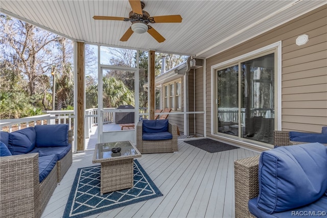 sunroom / solarium with ceiling fan and wood ceiling