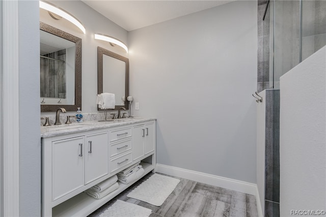 bathroom with hardwood / wood-style floors and vanity