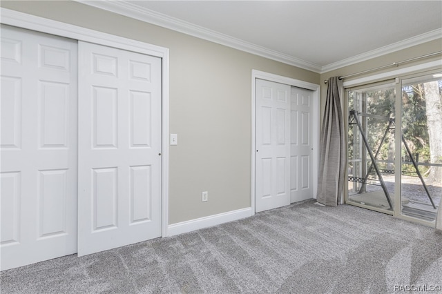 unfurnished bedroom featuring light carpet, access to outside, multiple closets, and ornamental molding