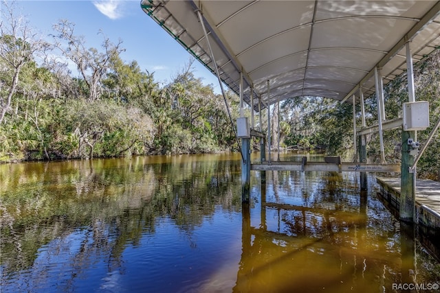 dock area featuring a water view