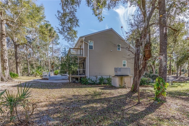 view of side of property with a balcony