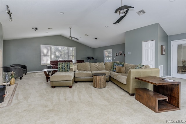 carpeted living room featuring ceiling fan and lofted ceiling