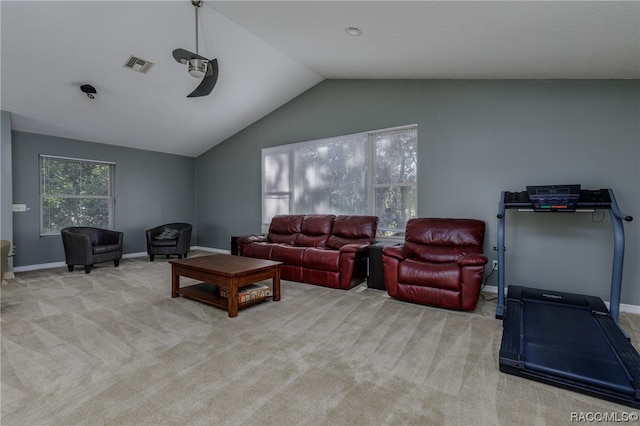 carpeted living room featuring ceiling fan and vaulted ceiling