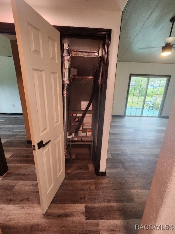 corridor with dark hardwood / wood-style flooring