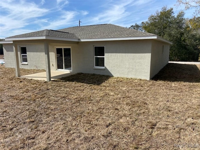 back of property featuring a patio