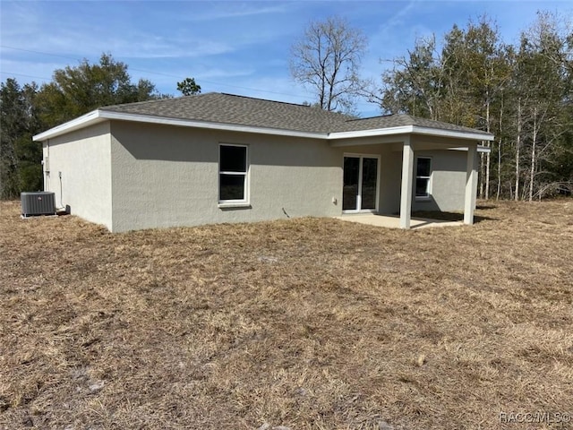 back of property featuring central AC unit and a patio area