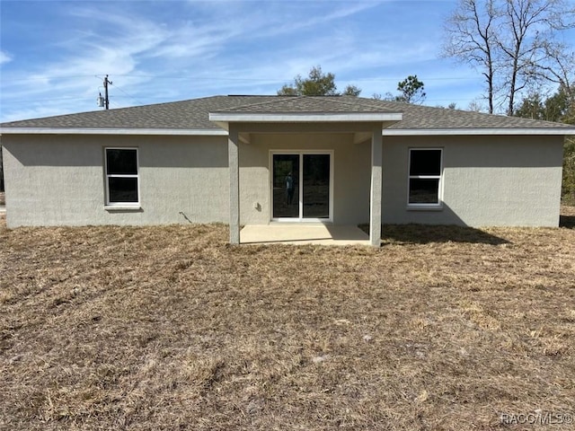 back of house with a patio area