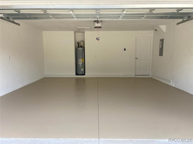 garage featuring water heater, a garage door opener, and electric panel