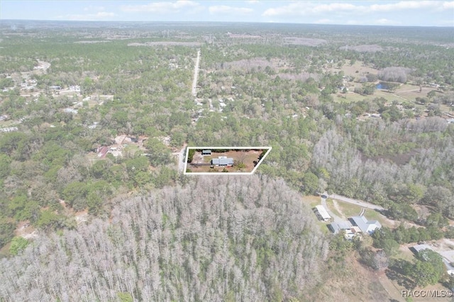 bird's eye view featuring a wooded view