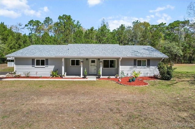 ranch-style house featuring a porch, a front lawn, and a shingled roof