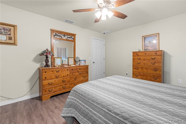 bedroom with hardwood / wood-style floors and ceiling fan