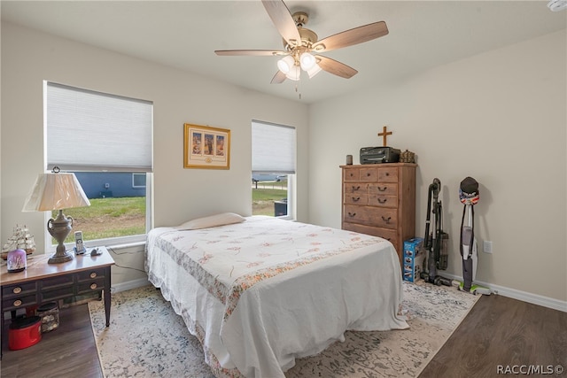 bedroom featuring hardwood / wood-style flooring and ceiling fan