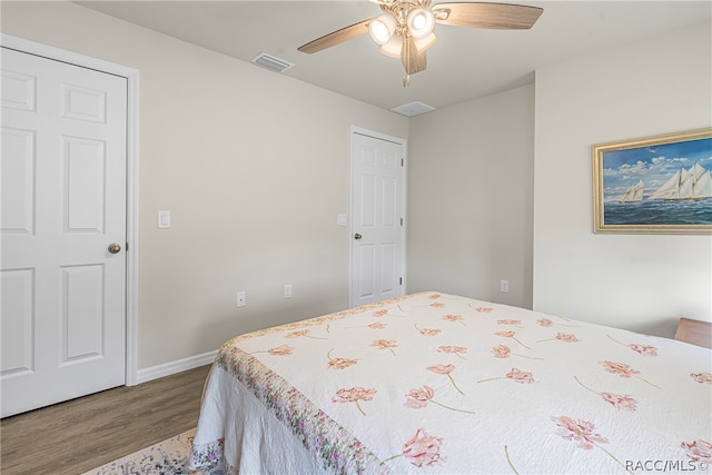 bedroom with hardwood / wood-style floors and ceiling fan